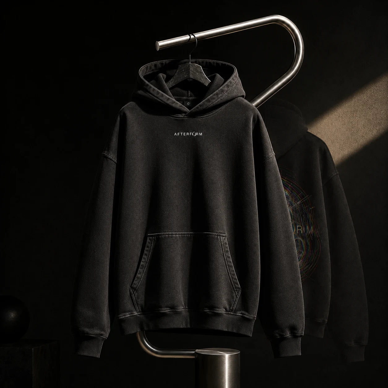 Washed black AFTERFORM hoodie study.