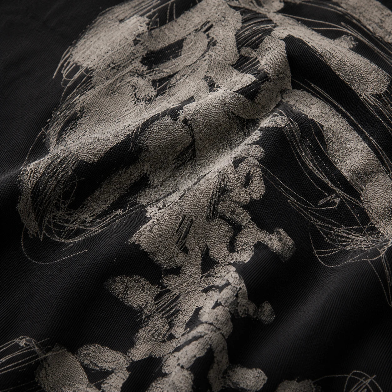 Washed black AFTERFORM REMNANT and VOID T-shirt still life.