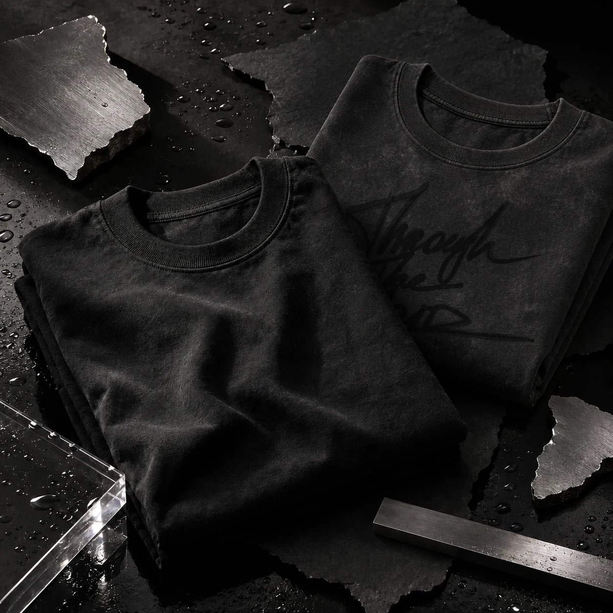 Washed black AFTERFORM REMNANT and VOID T-shirt still life.